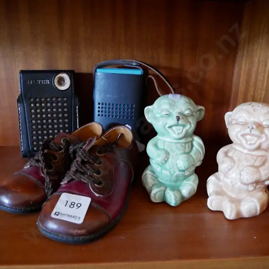 2 transistor radios, ceramic bear figurine, and childs shoes