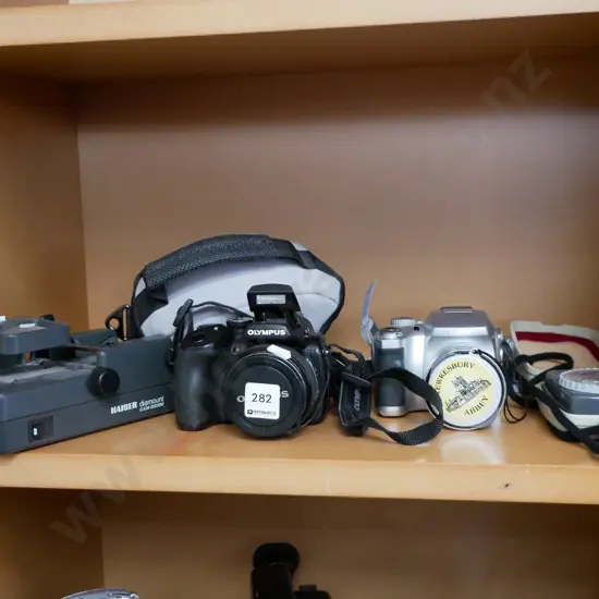 2 digital cameras, light meter, 8mm film editor