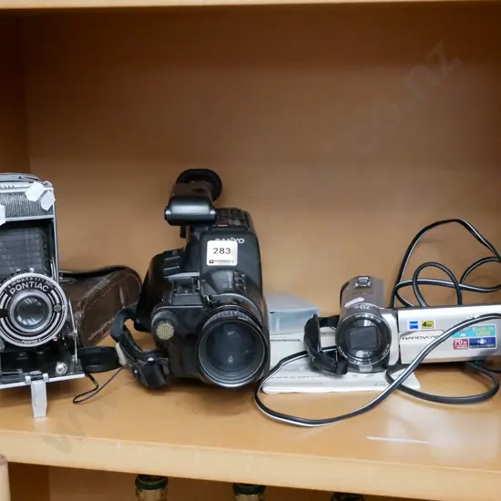 Pontiac concertina camera Sanyo video camera and Sony digital camera