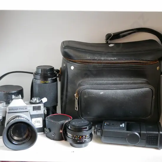 Praktica 35mm camera with camera bags, lenses, and flash