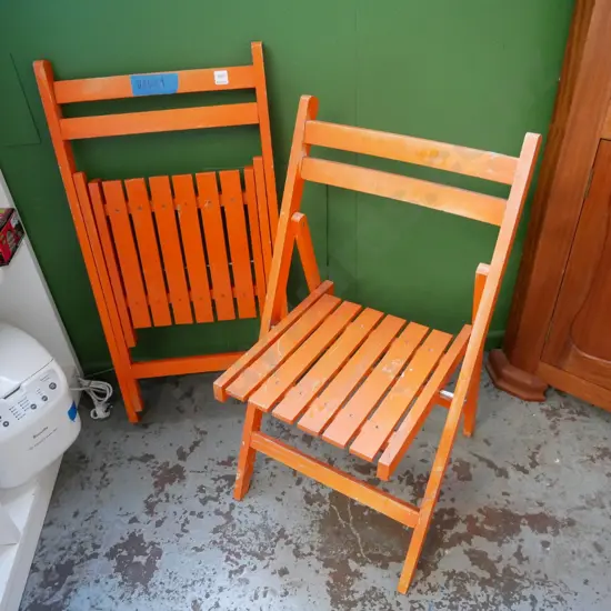 2 orange deck chairs