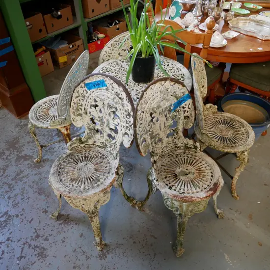 heavy cast alloy outdoor table with 4 cast alloy and cast iron chairs - needs repainting and finishing