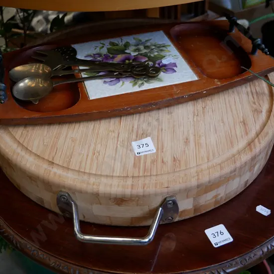 heavy circular bamboo chopping board, cheese board and various brass servers