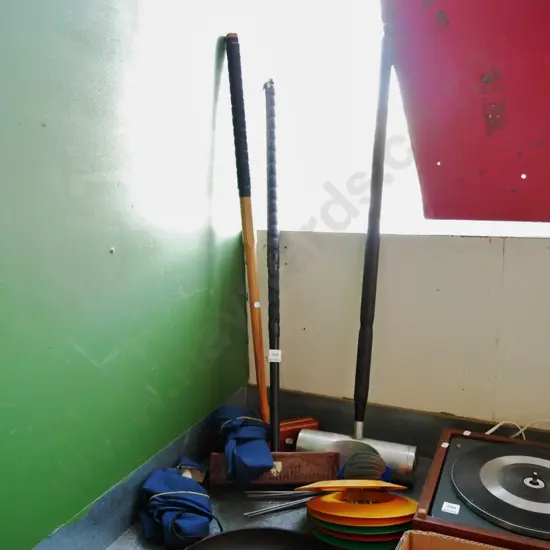 3 croquet mallets with homemade covers and disc holes and flags