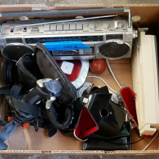 box; radio cassette player, computer joystick, headphones, scissors etc