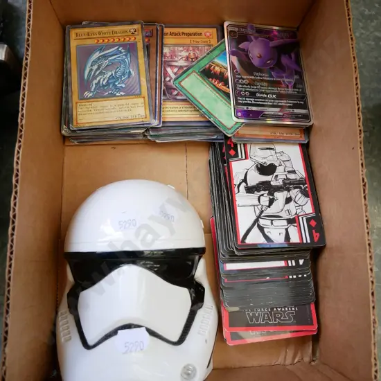 various collector cards and Star Wars stormtrooper case