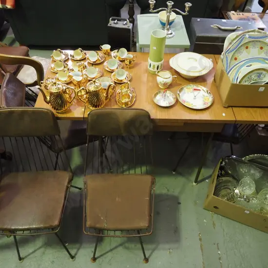 metal legged Formica topped extending dining table with 4 metal and vinyl upholstered chairs H- 780, W- 1360, D- 610