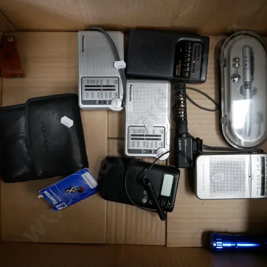 box; transistor radios, microphone, wallet and torch