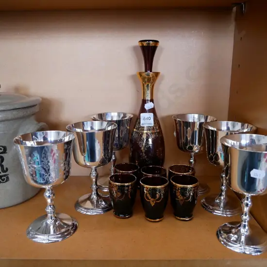 ruby glass and gold stoppered decanter and 6 plated goblets