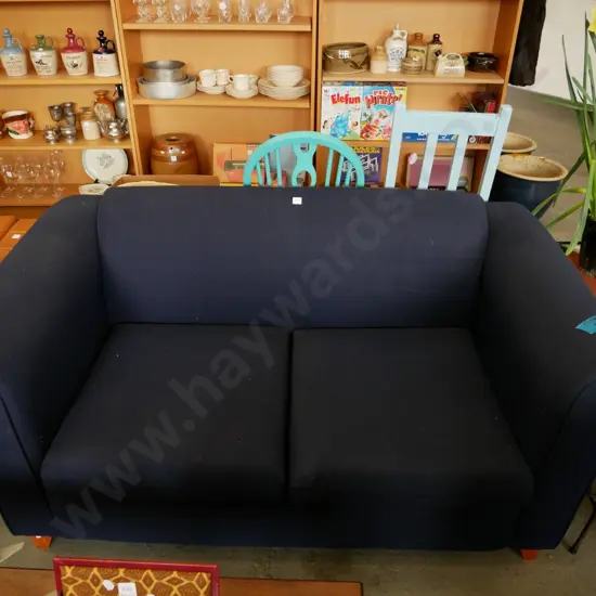 blue upholstered 2 seater Chesterfield settee - small rip to back