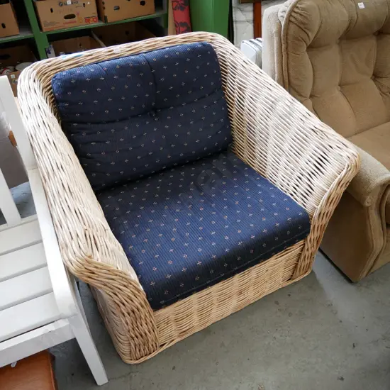 cane armchair with 2 cushions