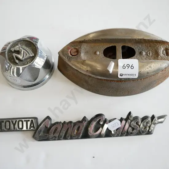 car badge, sad iron and small hub cap