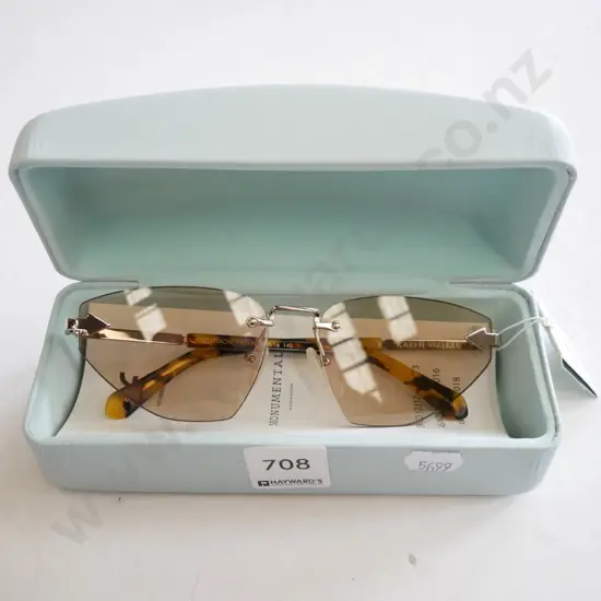 pair of designer sunglasses in case