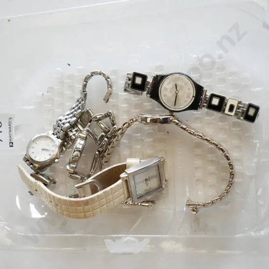 plastic tray of wristwatches