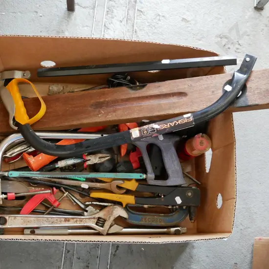 box of various tools, hacksaws, crescents, clamps etc