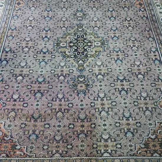 large woollen hand knotted Bidjar rug in copper and mauve tonings, large olive green central medallion