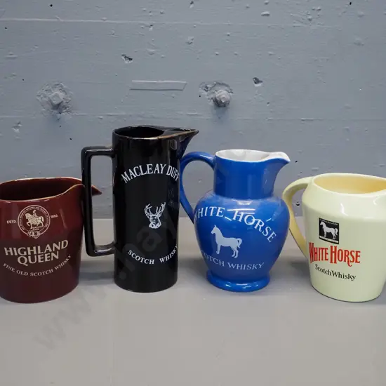 4 Scotch whisky water jugs - 3 made by Wade, blue White Horse is Portmeirion. Tallest is H180