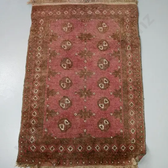 small hand-knotted wool Turkoman style small floor rug - overall fading L-1050 W-700