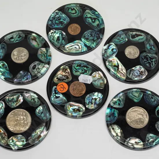 6 coasters with paua shell & a different coin in centre