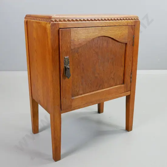 art deco oak bedside cabinet w. panelled door, drop handle, one shelf, square tapered legs. H-620 W-470 D-300