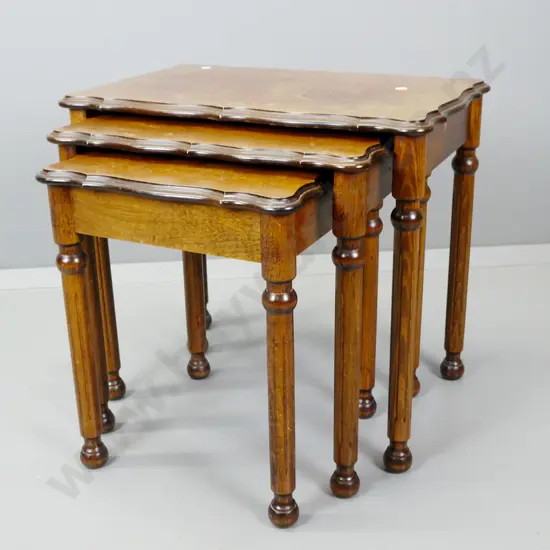 3 mid-century mahogany nesting tables with shaped front edge, fluted turned legs - rings and marks to tops of all 3