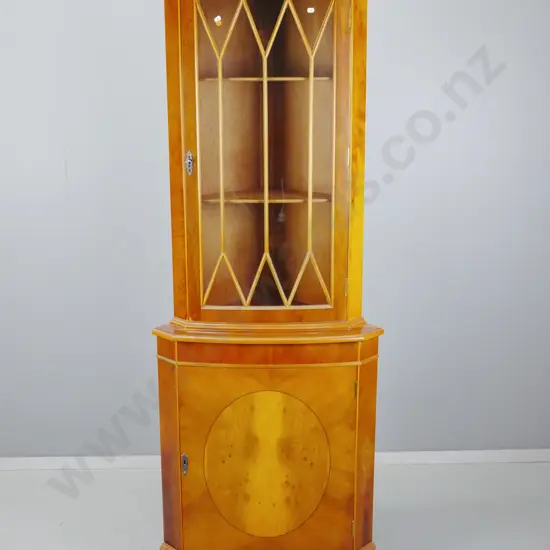 reproduction yew corner cupboard with astragal glazed top door, solid lower cupboard, 2 shelves in top, 1 in bottom