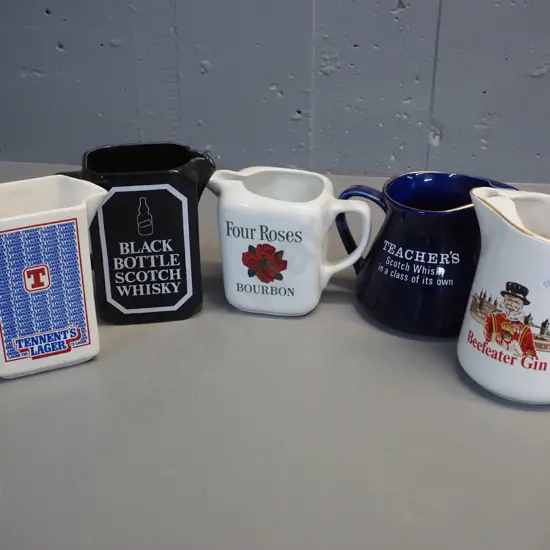 5 Scotch hisky, bourbon, gin and beer jugs, 3 by Wade, one Arabia Finland, one has no mark. Tallest is H150