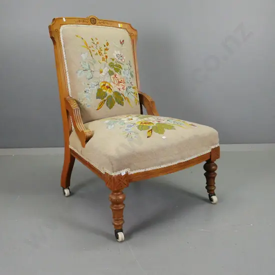Edwardian lady's chair with carved back, floral embroidered seat & back, turned front legs, on porcelain casters H-880