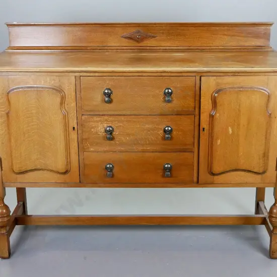 deco oak sideboard with 2 panelled doors, 3 drawers with drop handles, stretcher base - marks and wear to top and drawer
