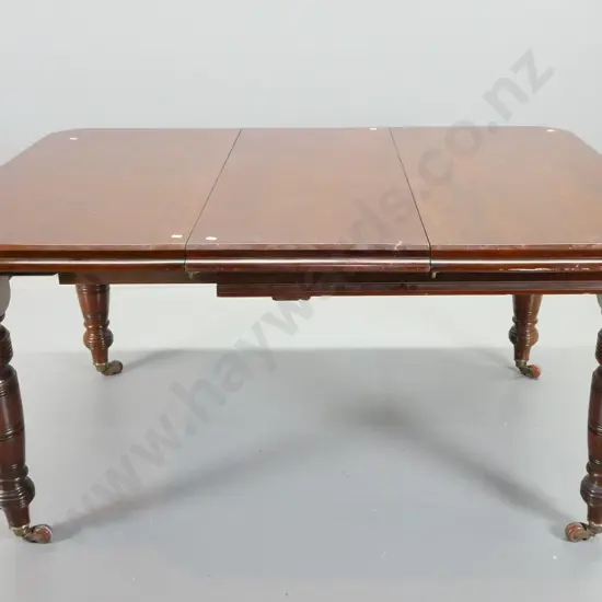 Edwardian mahogany turned leg draw-leaf dining table with 3 leaves, on porcelain casters - scratching to top H710