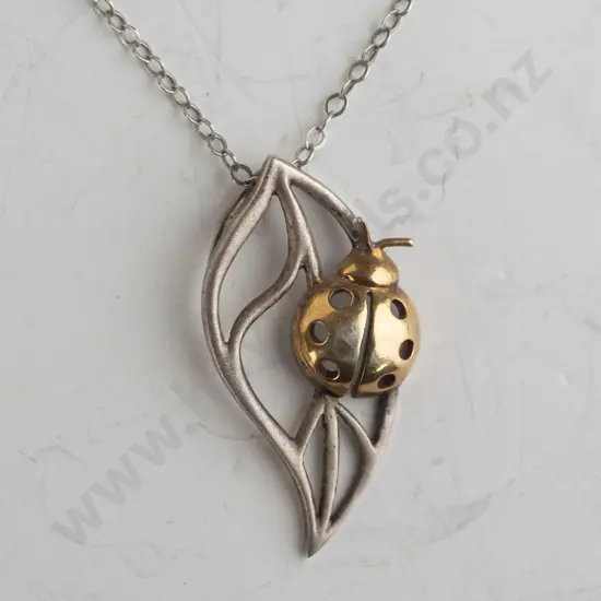 silver ladybug on leaf necklace stamped 925