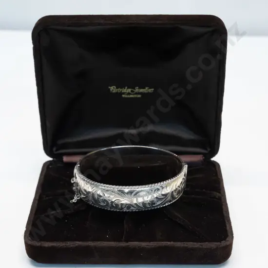 silver bangle with engravings on front half stamped stg stil