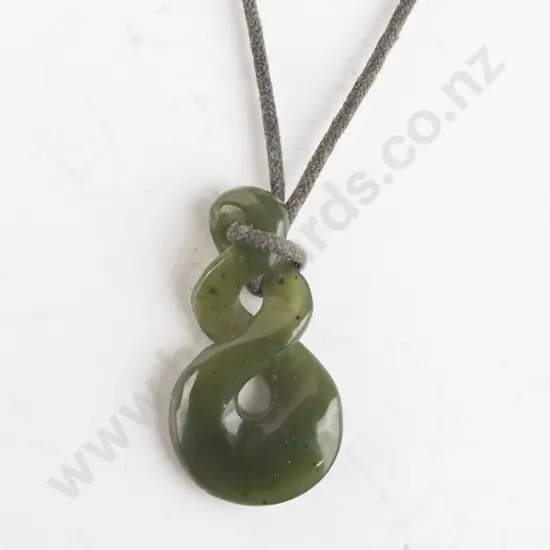 greenstone pendant on leather strand