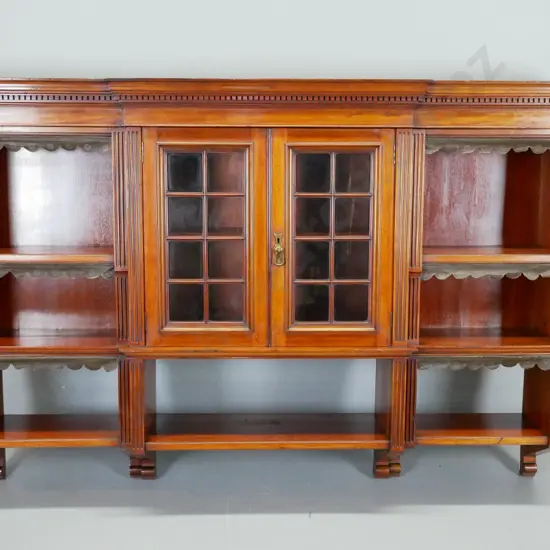 late 19th century mahogany break front hanging bookcase w/dentil moulding decoration to cornice, 2 astragal glazed doors