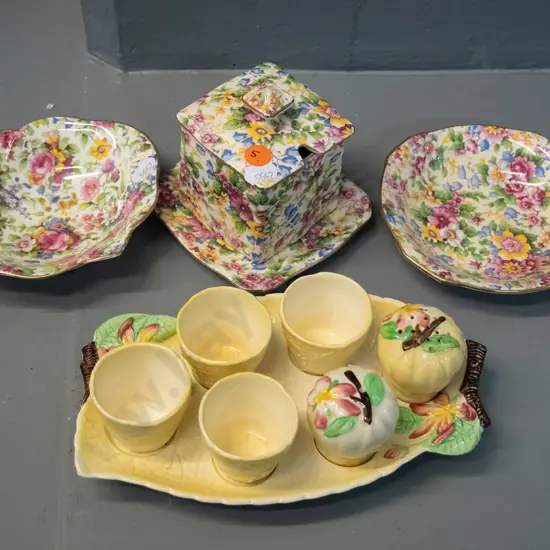3 pieces Royal Winton all-over-floral, 2 are "Cheadle" pattern, and a Carlton Ware eggcup set in "Apple Blossom" pattern