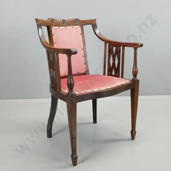 reproduction mahogany Regency-style armchair w/pierced lattice work decoration, square tapered legs, pink velvet