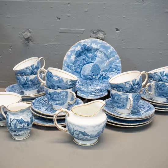 H&M Rural Scenes 26-piece tea set with 8 trios, 2 jugs - sugar bowl and one jug has browning