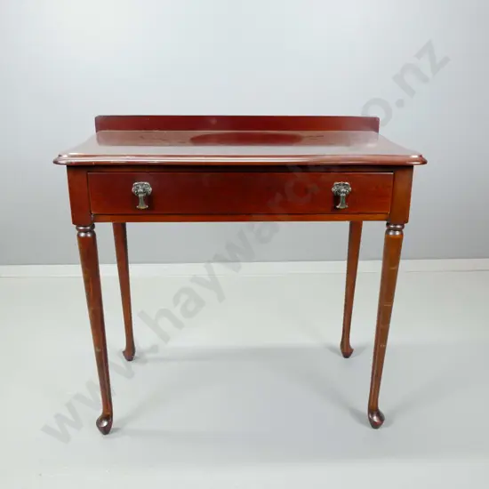 reproduction mahogany side table with single drawer, turned legs and pad feet. H-690 W-720 D-390