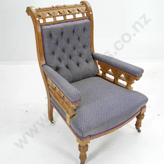 vintage oak ornately carved deep-button armchair on porcelain casters H1010 W670 D680