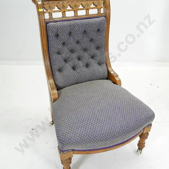 vintage oak ornately carved deep-button lounge chair on porcelain casters H980 W600 D600