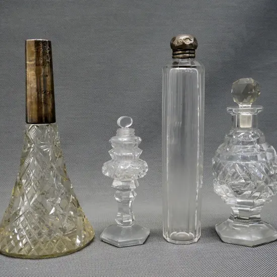 sterling mounted bottle, missing stopper, chip inside rim, sterling topped bottle H-180, and 2 stoppered scent bottles