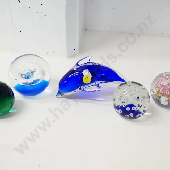 heavy art glass - 4 globe paperweights and a blue & clear dolphin with manufacturing flaw