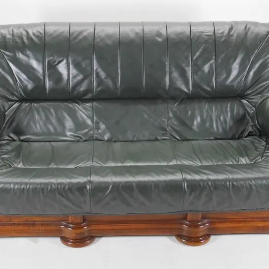 heavy oak-framed 4-seater settee with green leather upholstery H910 W1880 D960