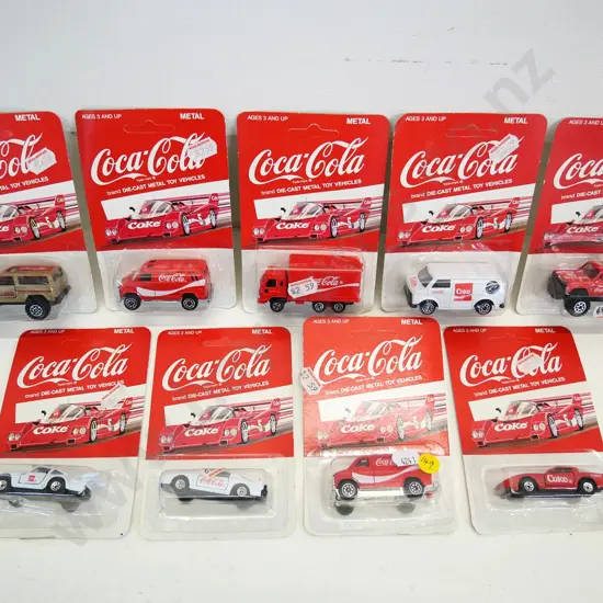 9 small carded Coca-Cola branded die-cast model vehicles