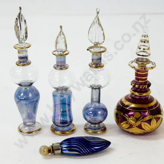 4 stoppered scent bottles, one with chip to rim (tallest H-135) and a blue stoppered scent/snuff bottle