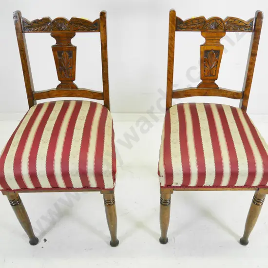 pair of beech Edwardian carved back dining chairs with striped damask upholstered seats, a bit wobbly, 1 has had repair