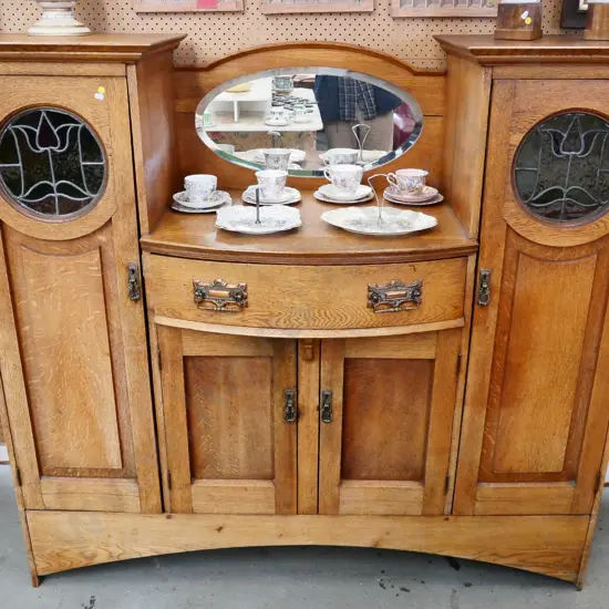 art deco sideboard with 2 stained glass and 2 solid doors, bevelled oval mirror, splits to some joins H1440 W1610 D470