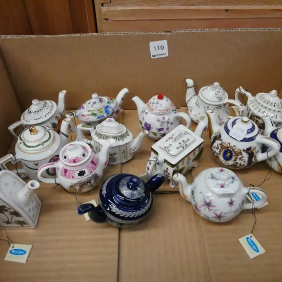 box of 14 miniature porcelain art teapots
