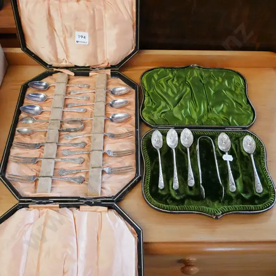 2 sets of cased cutlery