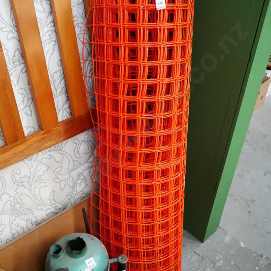 roll of orange plastic mesh netting